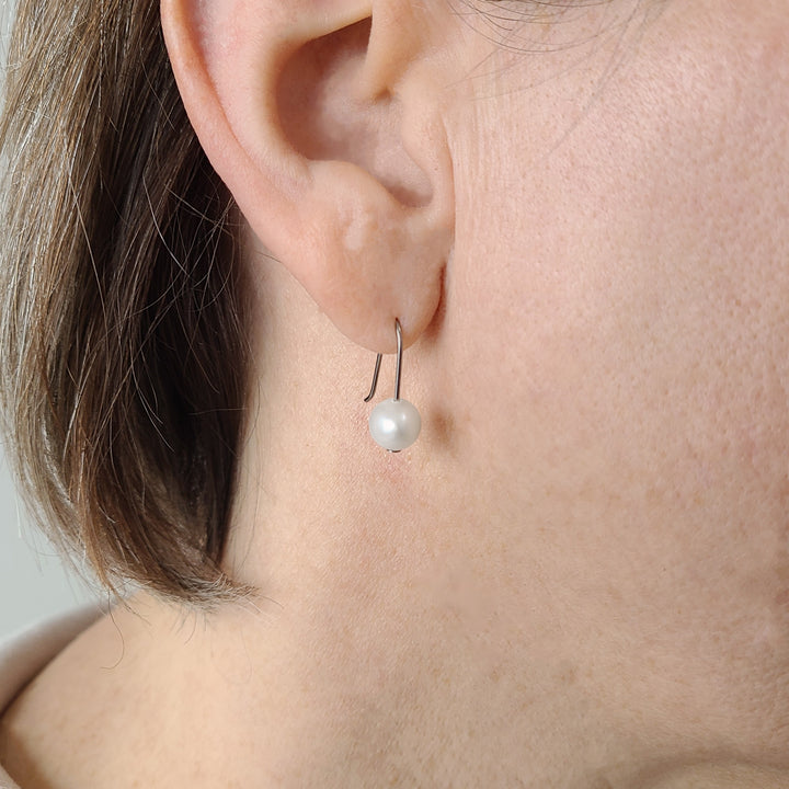 Minimalist pearl drop niobium earrings