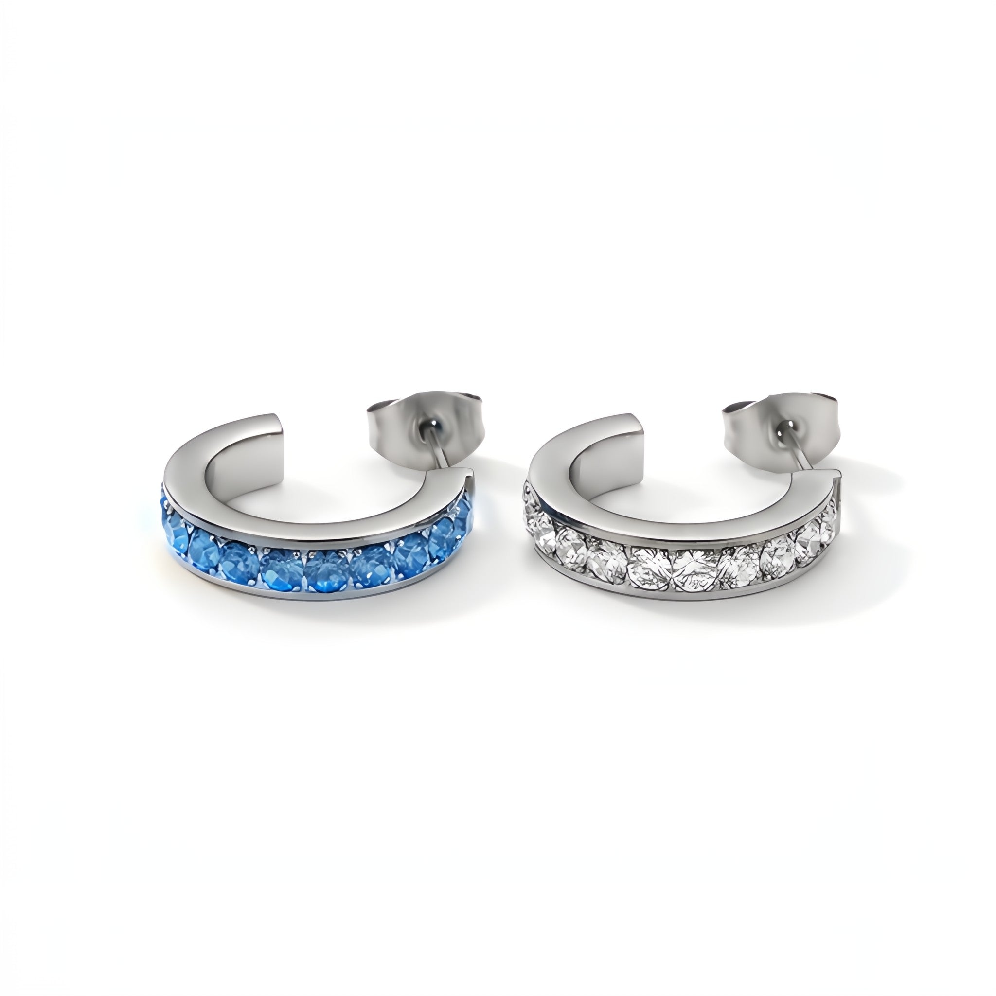 Pair of hoop earrings with blue gemstones and clear stones on a white background