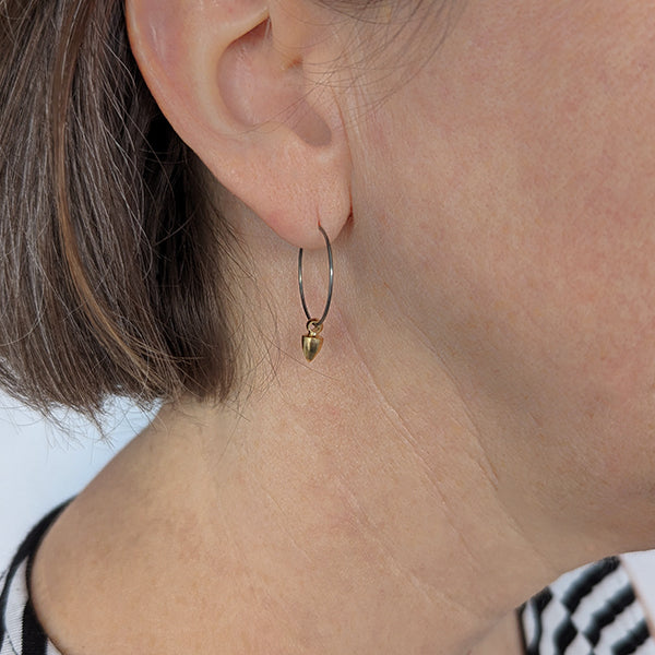 Titanium hoops with cone spike charms