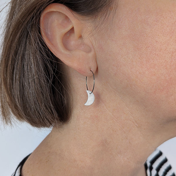 Pearl white moon titanium hoop earrings